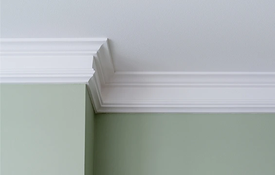 Ceiling molding installation in Portage, IN to enhance room elegance and visual detail.